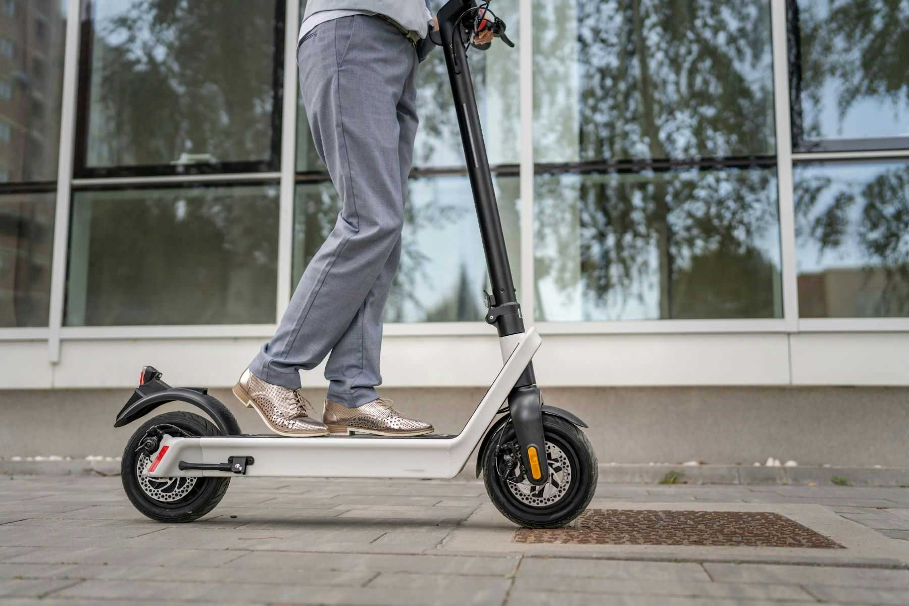 Person riding electric scooter
