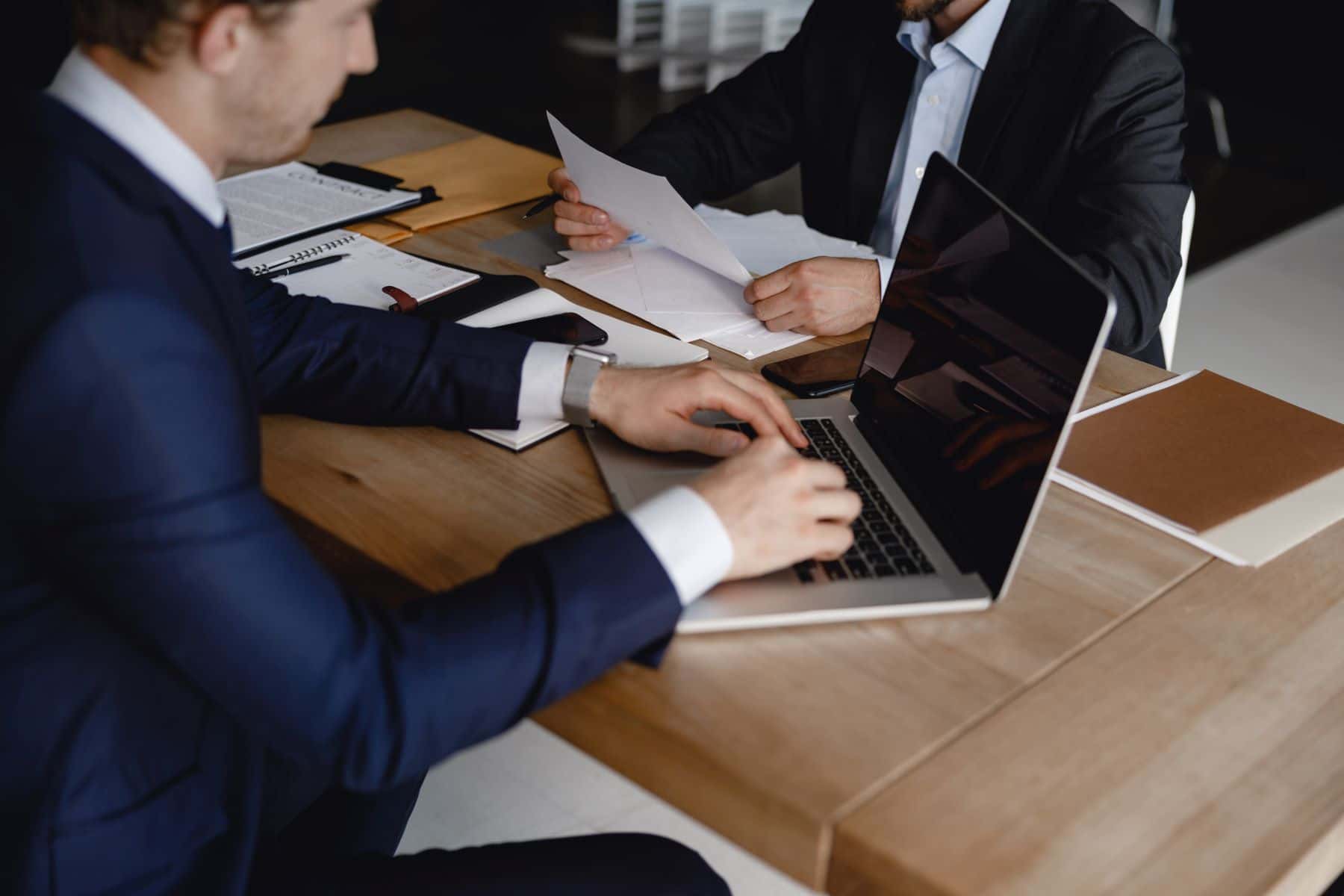 Two attorneys researching on laptop