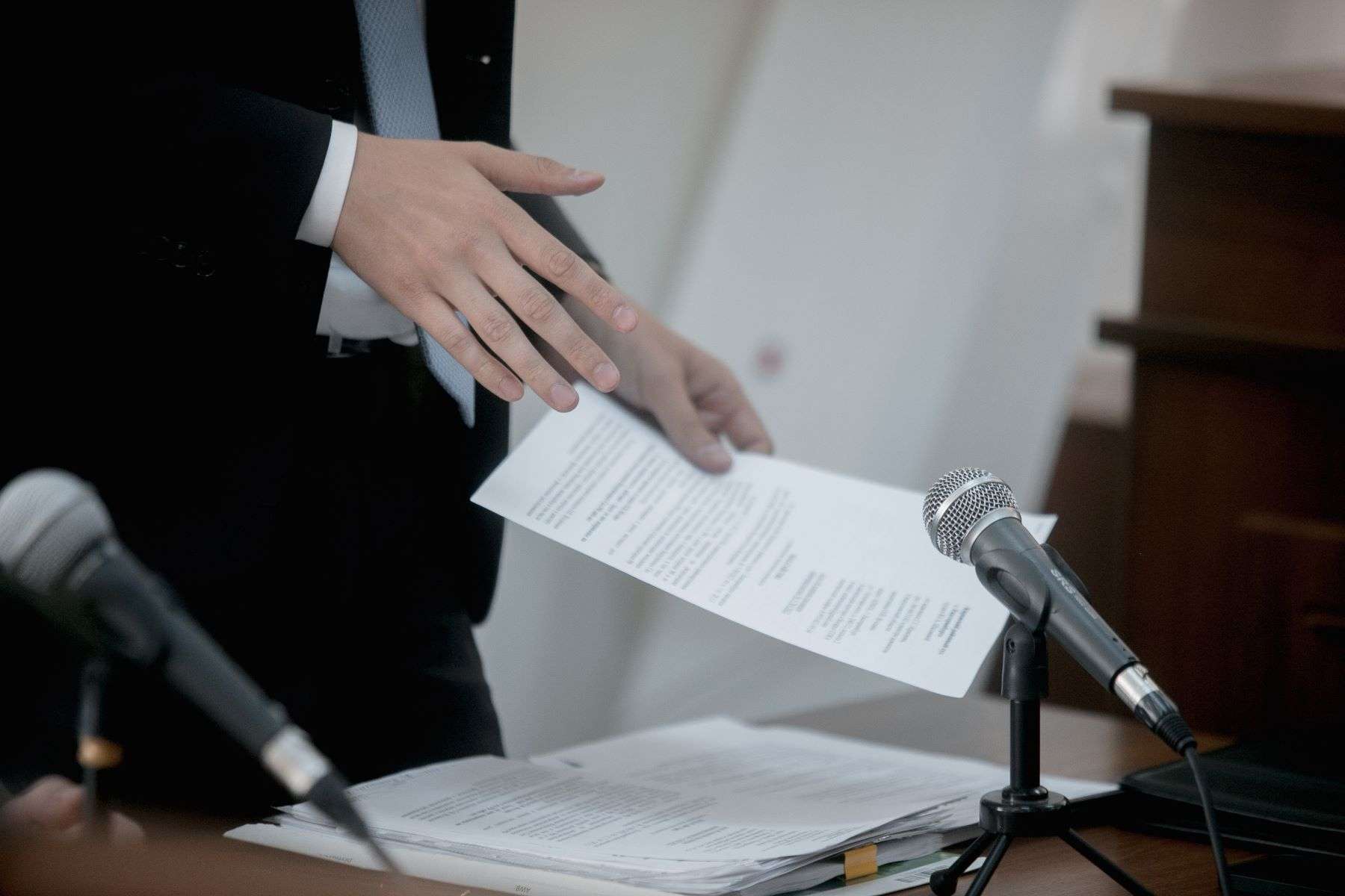 Attorney reviewing documents in courtroom