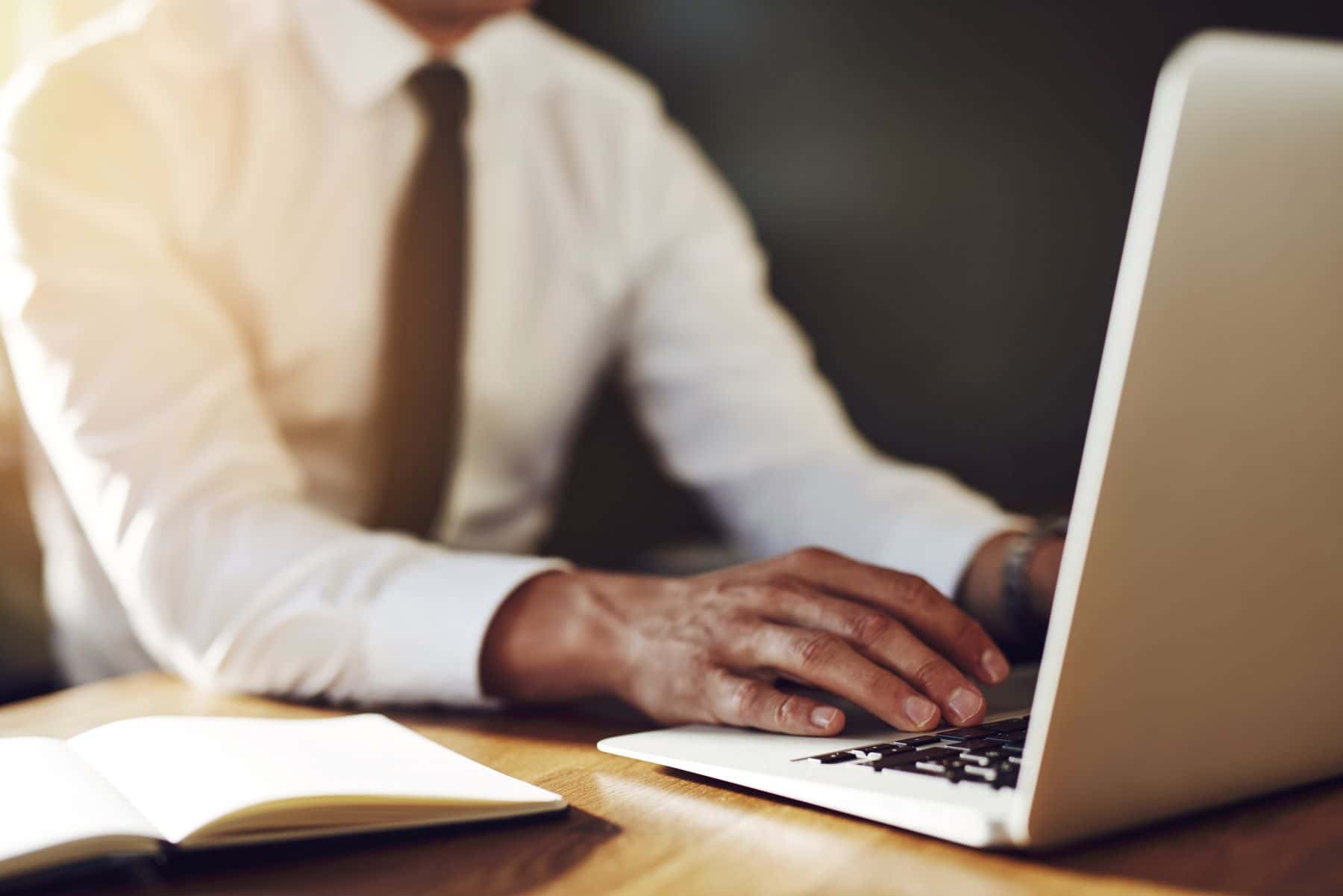 Paralegal working on laptop computer