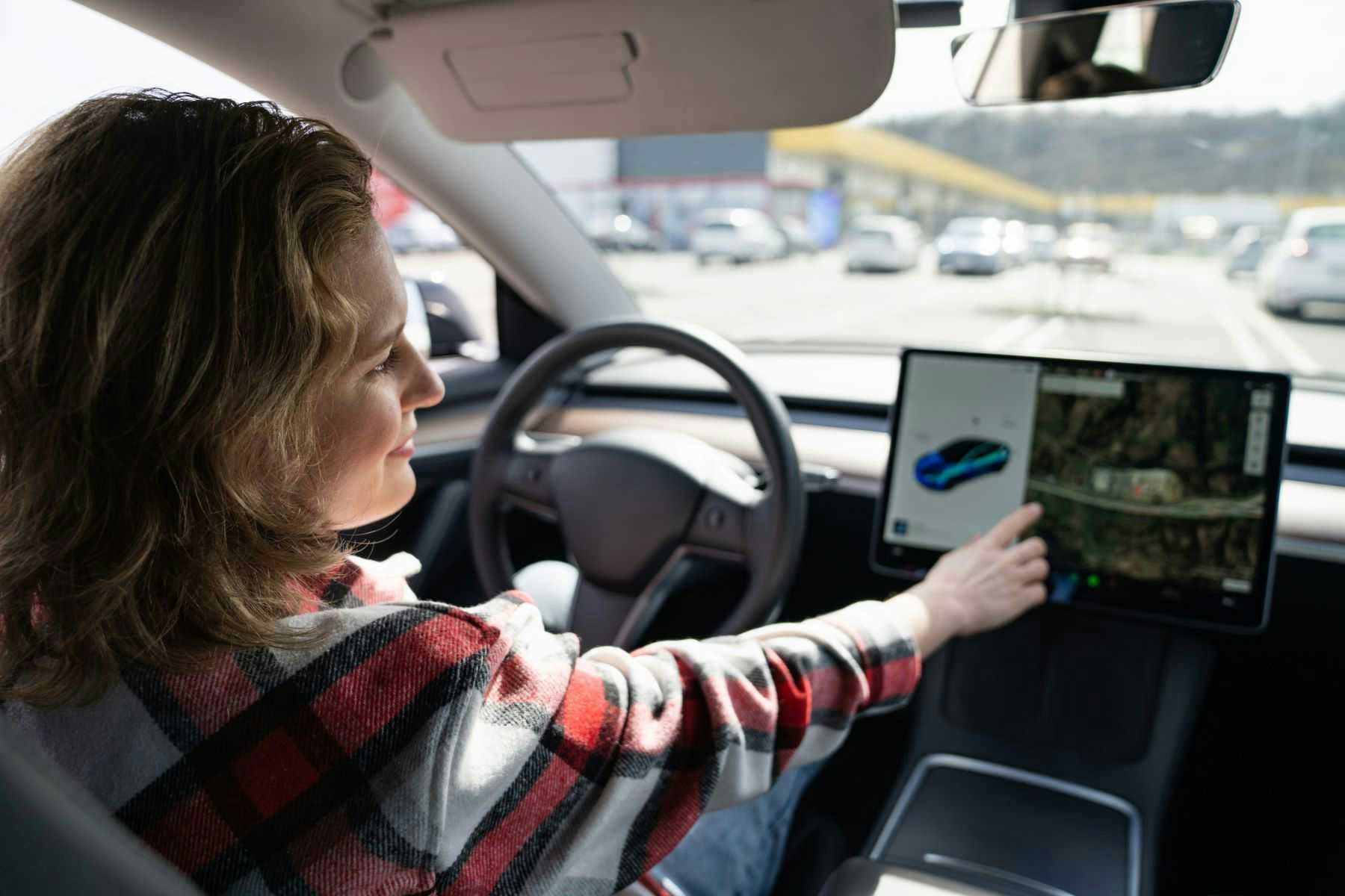 Woman in self driving car