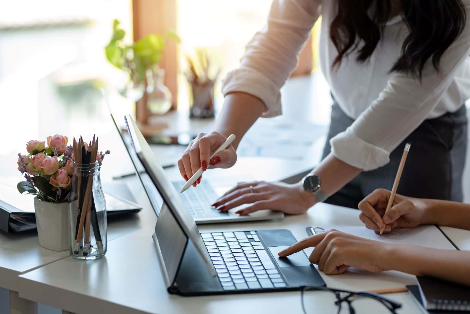 two people working on a laptop