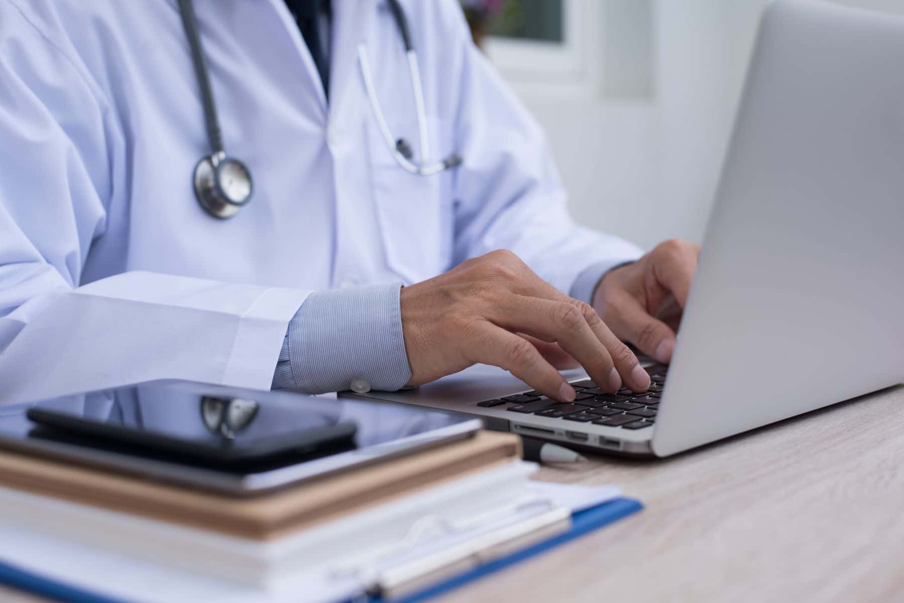 Doctor working on a laptop computer