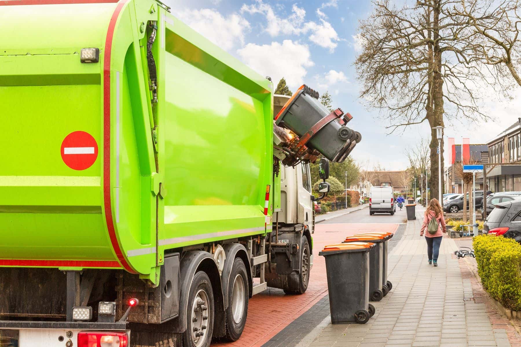Garbage truck collecting trash