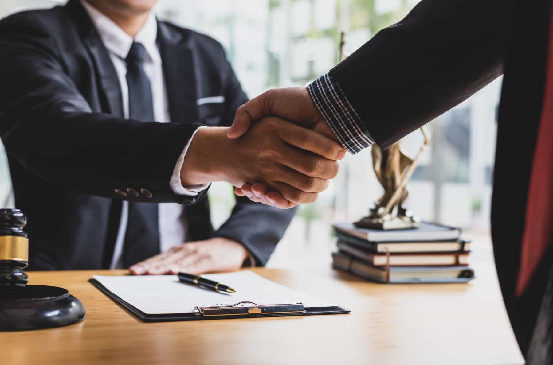Attorney shaking hands with expert
