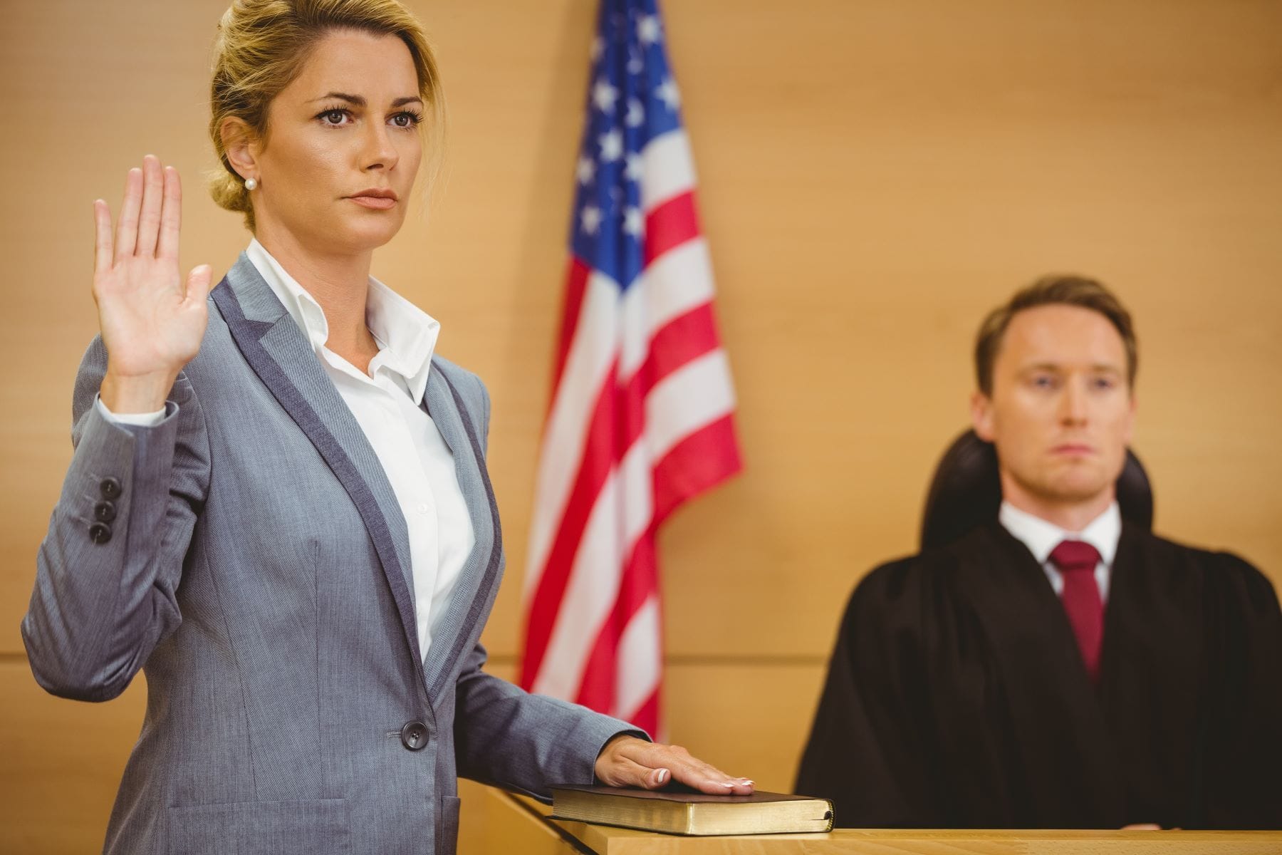 Expert witness taking oath in court